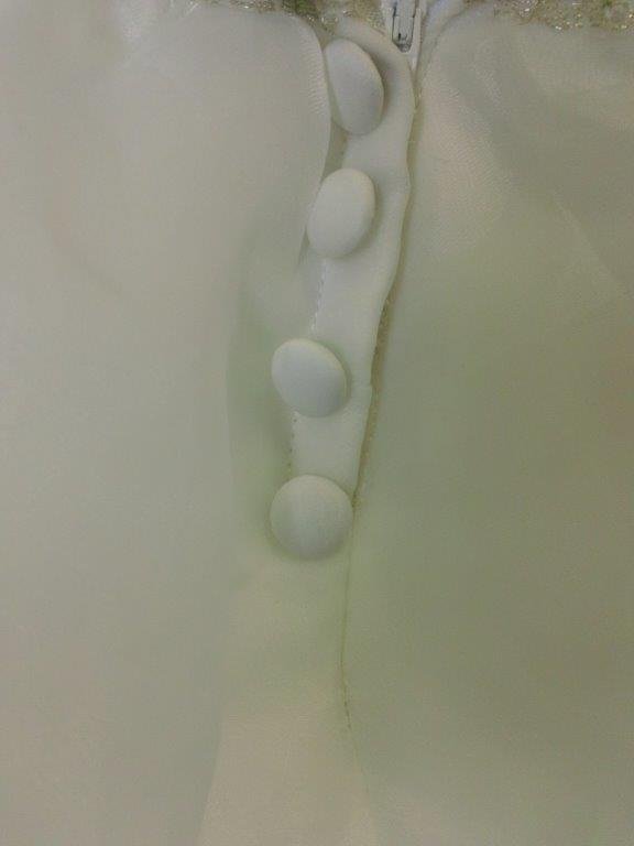 covered buttons over zipper